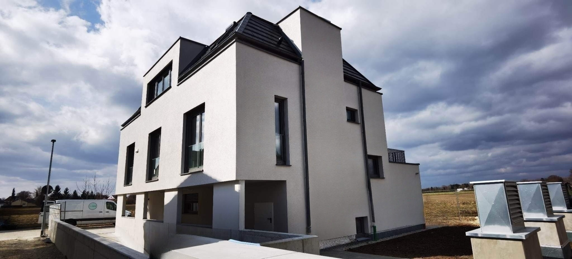 Modernes Einfamilienhaus mit meisterhafter Fassade von HaxPUTZ